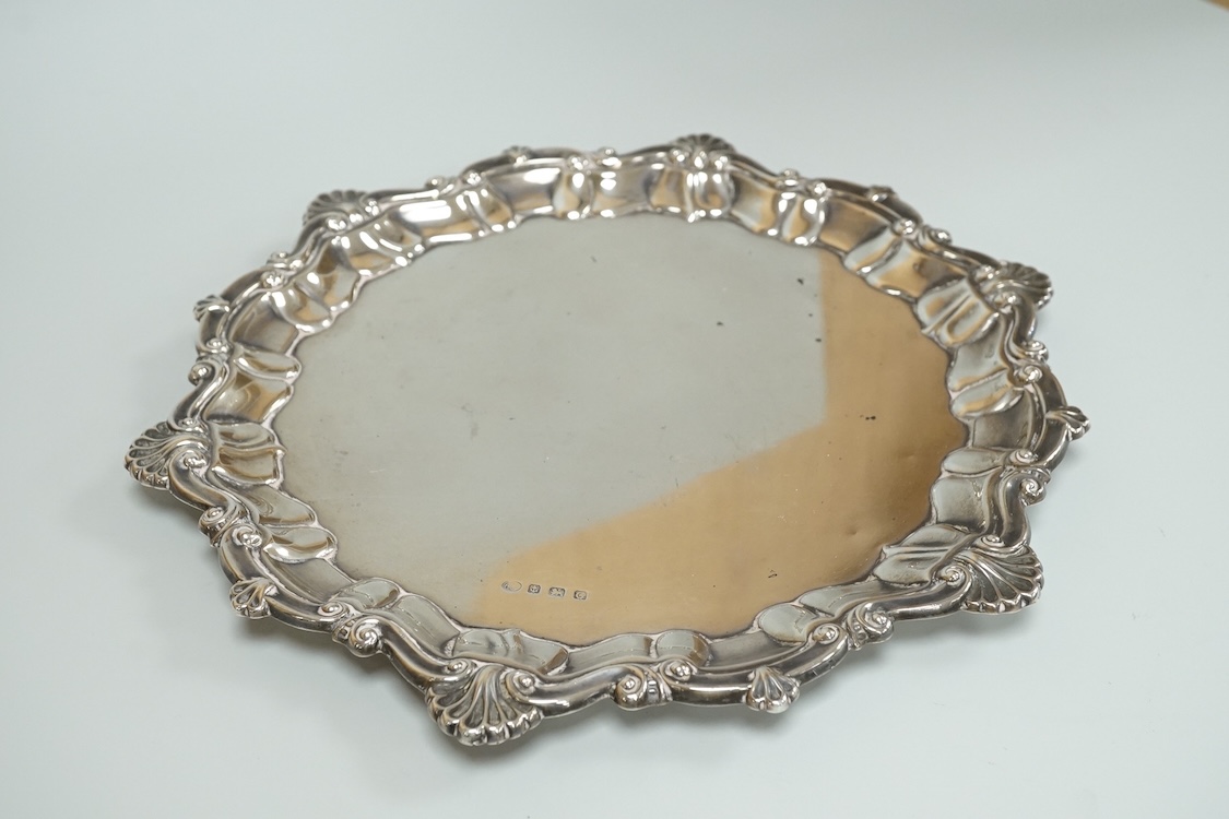 A George V silver salver by Alexander Clark & Co Ltd, of shaped circular form, with shell and scroll border, Birmingham, 1931, 27cm, 16oz.